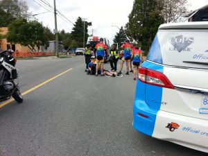 West Vancouver Police Cst. Jeff Palmer being worked on by paramedics during a charity bike race in 2015.