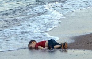 The body of three-year-old Alan Kurdi washes ashore the Mediterranean Sea.